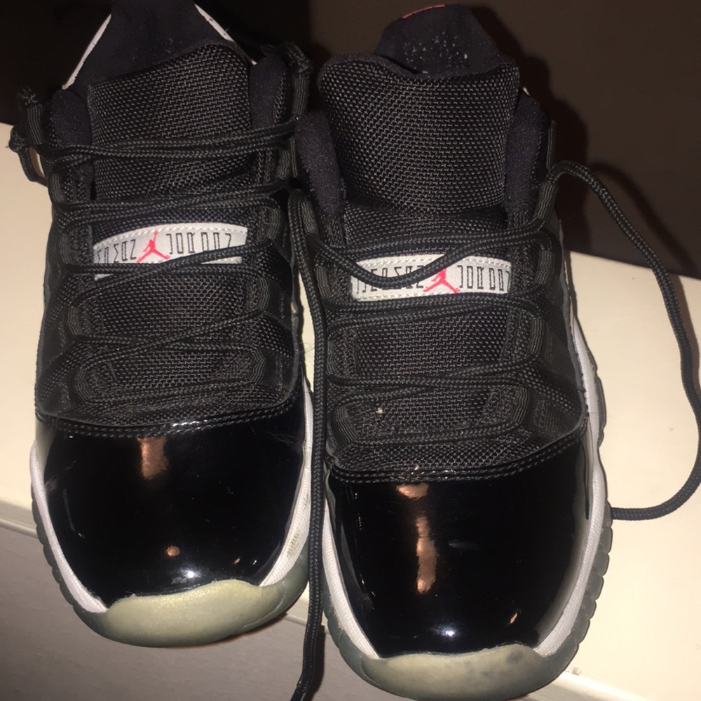 Kids black Jordan’s low 11’s